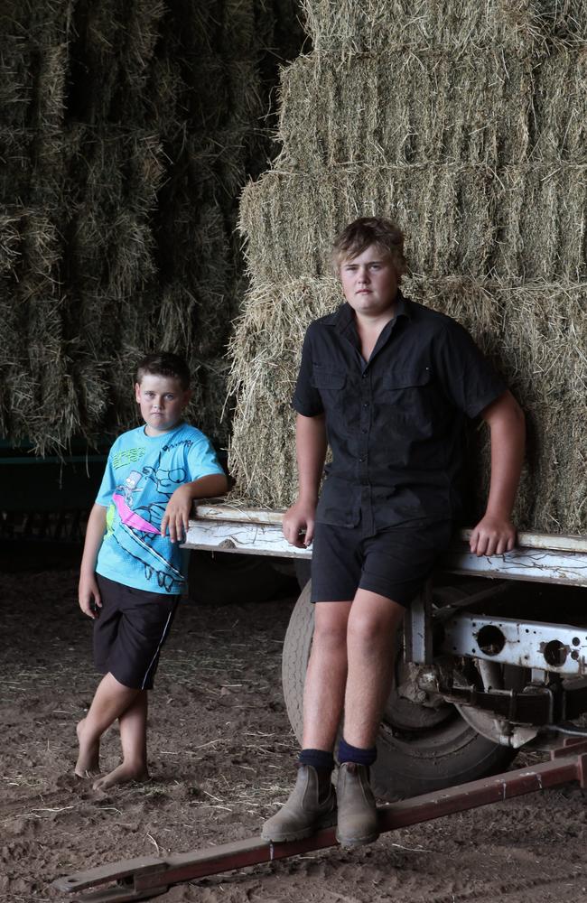 Nick, 15, and Jake, 11, Taylor after the floods. Picture: David Kelly