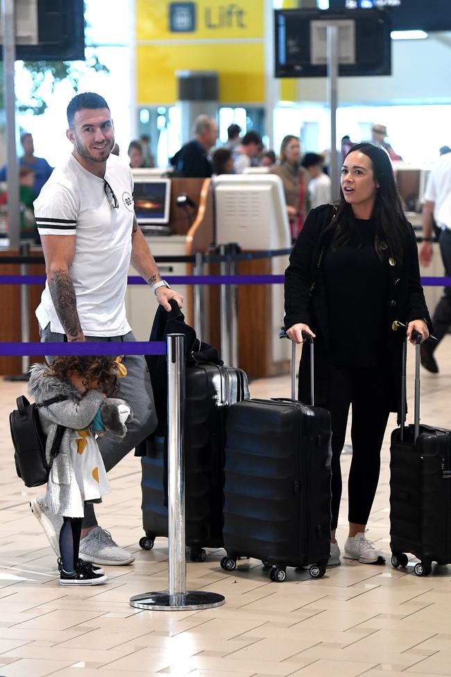 Darius Boyd with wife Kayla and daughter Willow at Brisbane Airport yesterday. Picture: Dan Peled/AAP