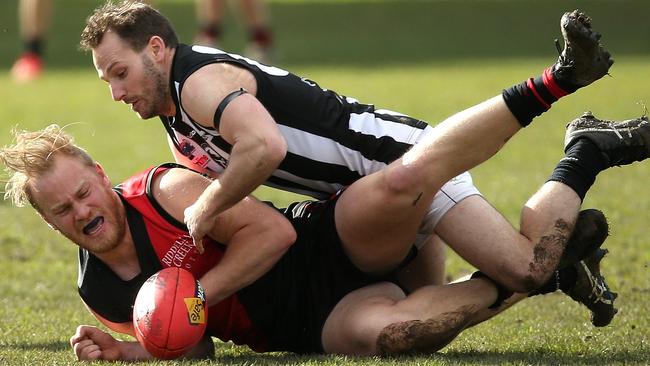 Steven Boyall takes down Liam Berry. Picture: Hamish Blair