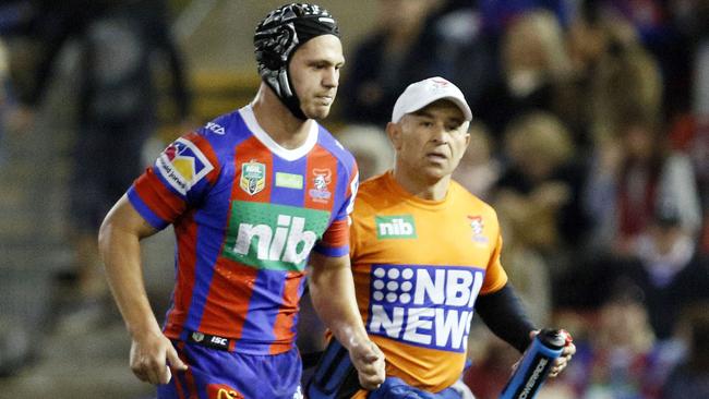 Kalyn Ponga of the Knights leaves the field with a hamstring injury.