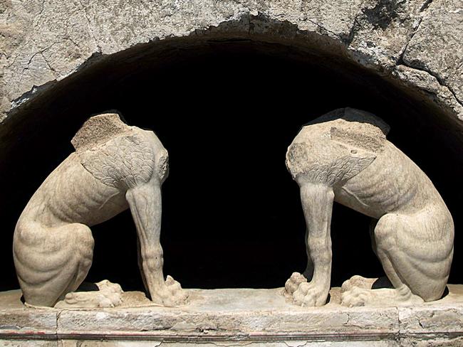 In this handout photo released by the Greek Culture Ministry on Thursday, Aug. 21, 2014, two large stone sphinxes are seen under a barrel-vault topping the entrance to an ancient tomb under excavation at Amphipolis in northern Greece. Archaeologists excavating the large grave mound on Thursday asked politicians and others seeking guided tours of the site to leave them in peace until the dig is completed. The partially uncovered tomb, from the end of Greek warrior-king Alexander the Great’s reign, has captivated the public imagination, fueling wild speculation that it may contain rich treasure and the bones of an ancient celebrity. (AP Photo/Culture Ministry, HO)