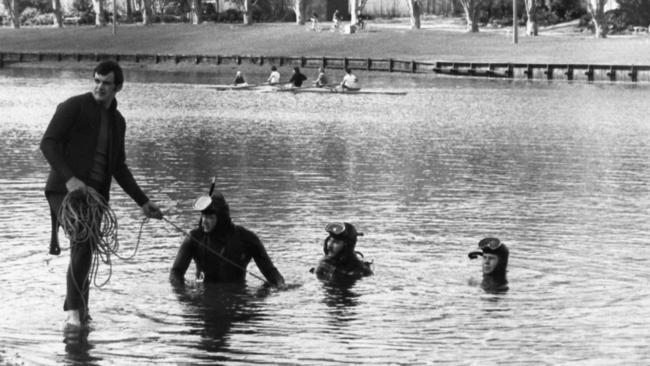 Police divers search the River Torrens for the missing girls in September 1973.