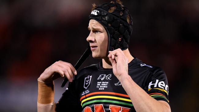 Matt Burton with his black headgear during his debut against the Sharks in August last year.