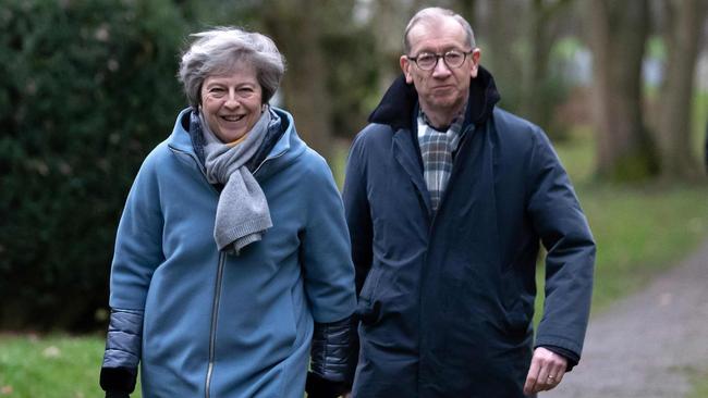 Theresa May and her husband Philip after attending a church service, near her Maidenhead constituency. No prizes for guessing what she was probably praying for. Picture: AFP.