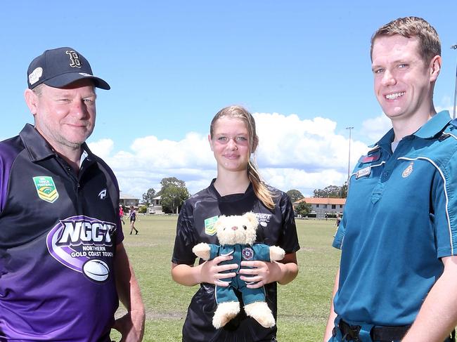 Picture of (L-R) Leigh Mitchell, Emma Mitchell and Ollie Nicol. Emma made the call that resulted in Leigh surviving a heart attack. 6 November 2022 Coomera Picture by Richard Gosling