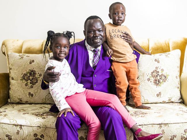 02/06/2021 Ambrose Mareng, pictured with his daughter About Mayar (4) and son Nihiah Mayar (2), is the chairperson and founder of the SUDD foundation, which represents the South Sudanese community in Victoria. He wants the government to put cultural workers in vaccine centres etc to help people navigate the vaccine process.  Aaron Francis/The Australian