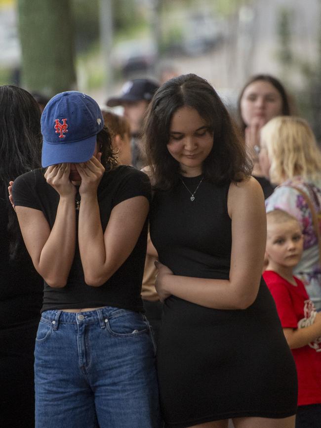 One of the attendees is overcome at the vigil. Picture: Jeremy Piper