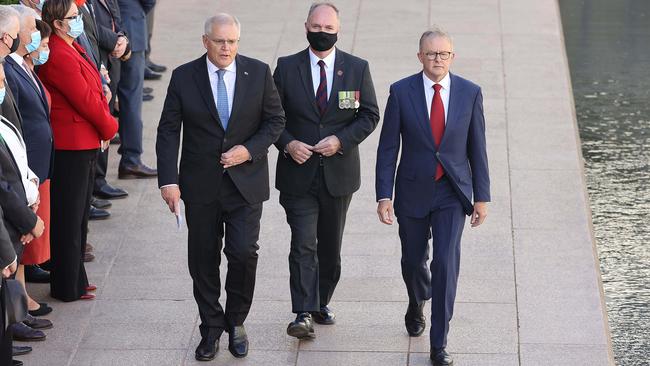 Scott Morrison, left, Australian War Memorial director Matt Anderson and Anthony Albanese at the Last Post Ceremony for the Opening of Parliament in Canberra on Monday. Picture: Gary Ramage