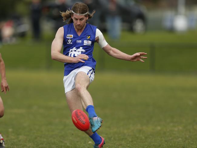 Patrick Wilson takes a kick for Hastings. Picture: Valeriu Campan