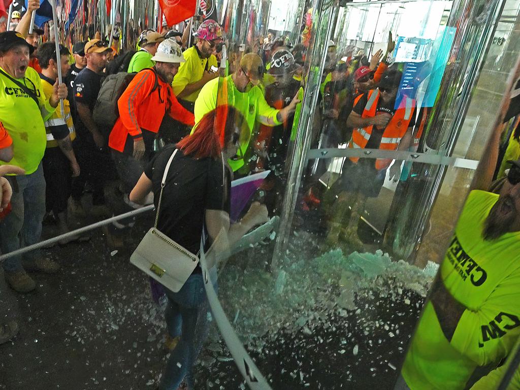 Thousands of CFMEU union members march in a protest a glass door was broken and windows were pounded by fists and hands, Brisbane. Picture: Lyndon Mechielsen