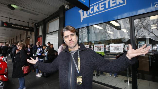 AFL footy fans queuing for tickets at Ticketek Exhibition Street after their website failed this morning. Richmond member John Karadakis. Picture: David Caird