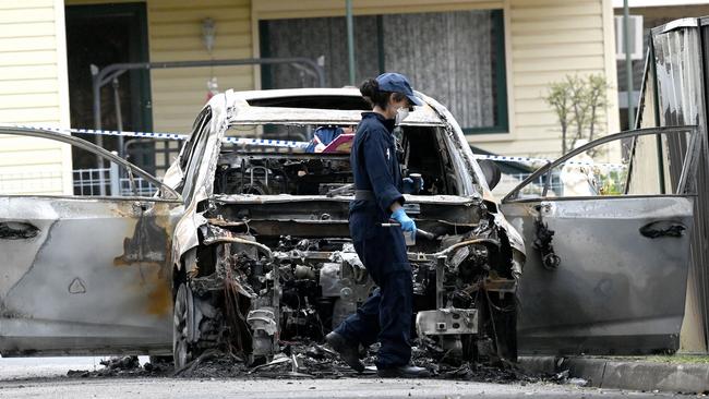 The burnt out car believed to be involved in the shooting deaths of two Hamze family members in Guildford. Picture: NCA NewsWire / Jeremy Piper