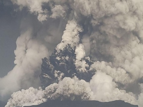 Hunga Ha'apai in the forefront and Hunga Tonga 'o the left. The plumes up to 20km above sea level. Picture: Tonga Geological Services, Government of Tonga