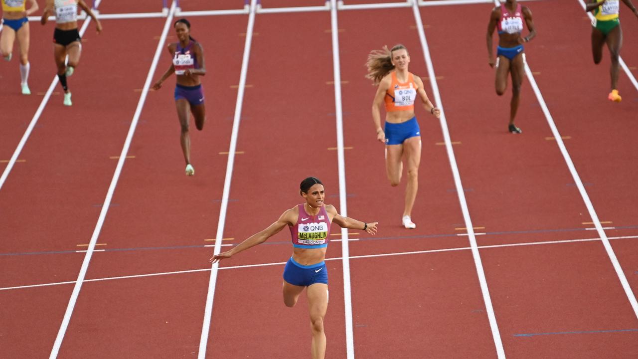 USA's Sydney Mclaughlin crosses the finish line to win the women's 400m hurdles final and break a world record during the World Athletics Championships. (Photo by Jewel SAMAD / AFP)