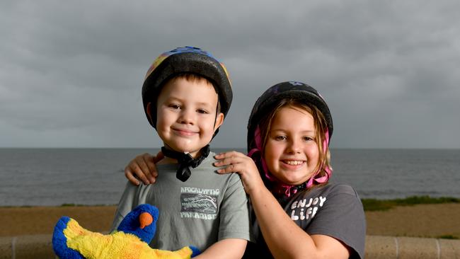 Carson. 5, and Ellie MacDonald, 9, enjoy a scooter ride along the Strand. Picture: Evan Morgan