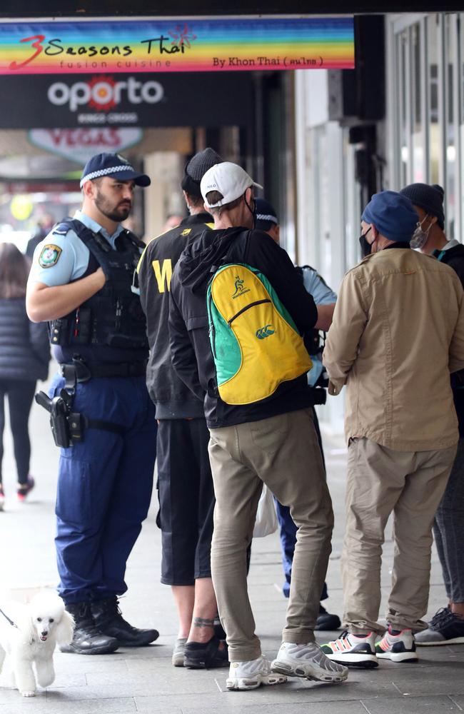 NSW Police seen telling people to move on as they patrol the streets of Kings Cross on Thursday. Picture: Matrix Media Group