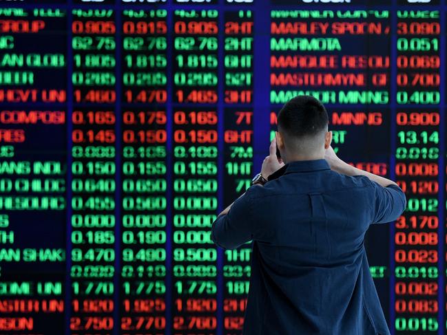 SYDNEY, AUSTRALIA - NCA NewsWire Photos AUGUST, 12, 2020: A man takes a photo of the digital market board at the Australian Stock Exchange (ASX) in Sydney. Picture: NCA NewsWire/Bianca De Marchi