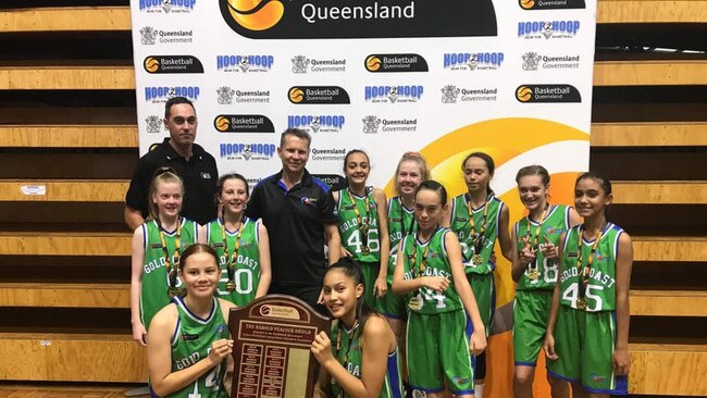 Gold Coast basketball juniors with the Harold Peacock Shield. Picture: SUPPLIED