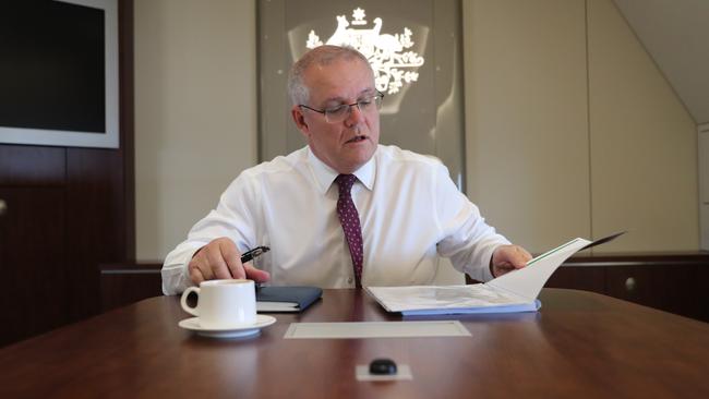 Australian Prime Minister Scott Morrison prepares his speech on the plane ahead of the G7 Summit in Cornwall. Picture: Adam Taylor/PMO