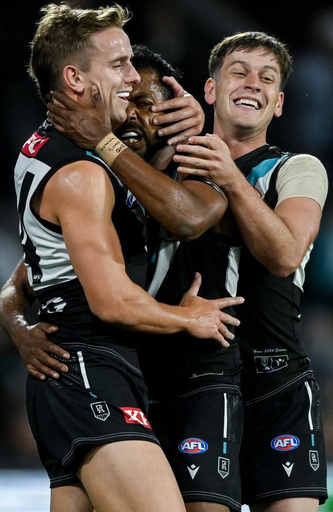 Willie Rioli, Jackson Mead and Zak Butters celebrate a goal against the Bombers. Picture: Mark Brake/Getty Images