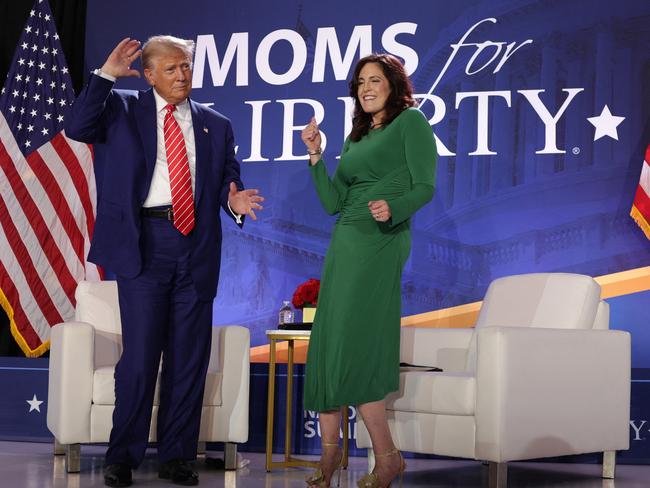 Donald Trump (L) and Co-founder of Moms for Liberty Tiffany Justice (R) dance on the stage during the 2024 Joyful Warriors National Summit on August 30, 2024 in Washington, DC. Picture: AFP