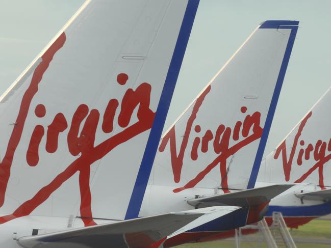 General file photos around Sydneys domestic Airport . Tail fins of various Virgin aircraft .