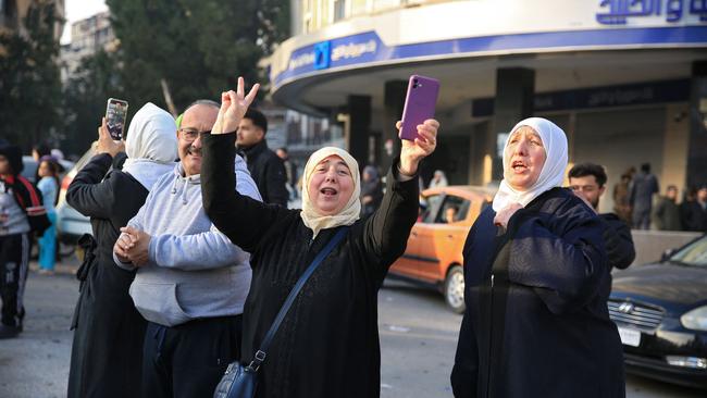 Syrians celebrate in the central city of Homs o after rebel forces entered Syria's third city overnight on December 8. Picture: Aref Tammawi/AFP