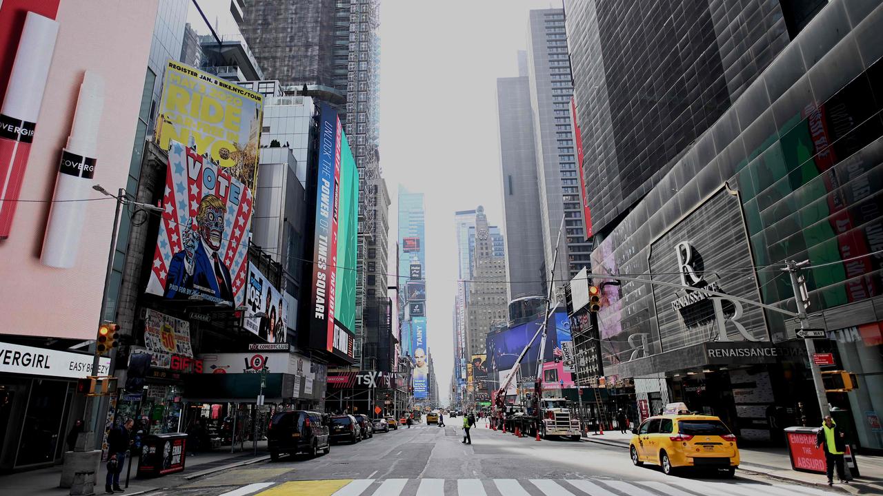 An almost empty street is seen at Times Square in Manhattan on March 16, 2020 in New York City. Picture: Johannes Eisele / AFP.