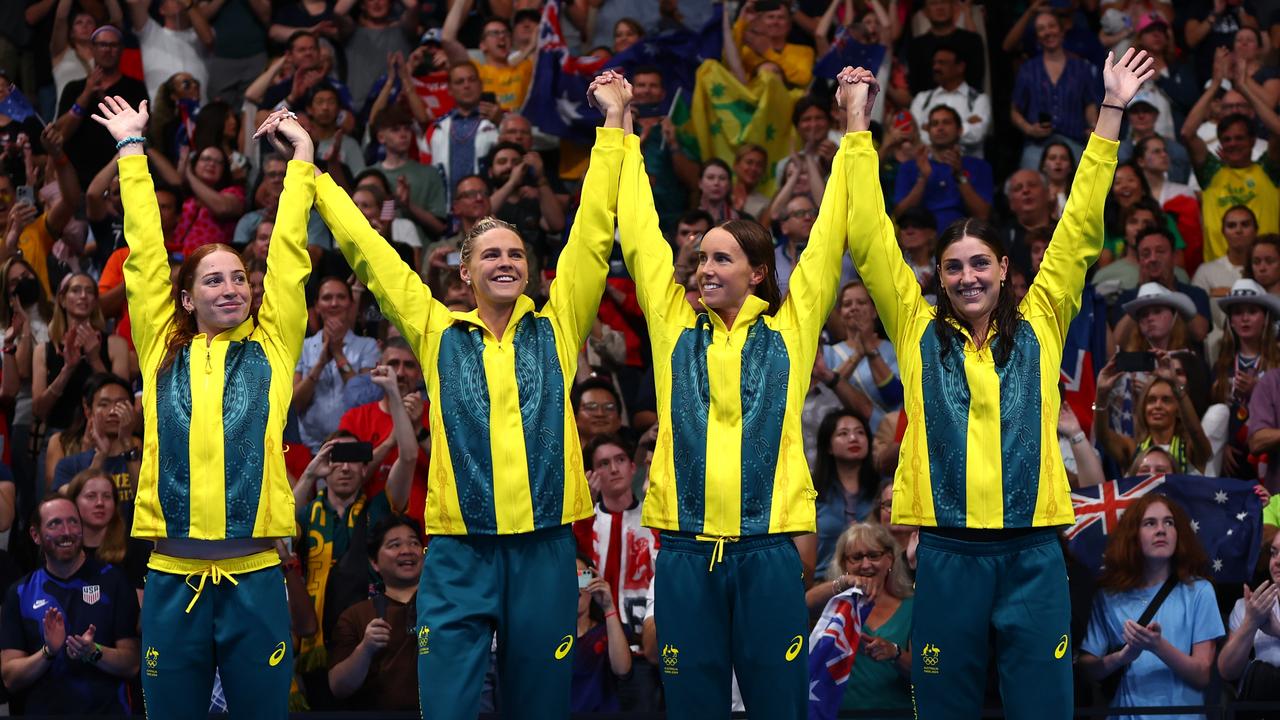 Mollie O'Callaghan, Shayna Jack, Emma McKeon and Meg Harris celebrate on the dais. (Photo by Maddie Meyer/Getty Images)