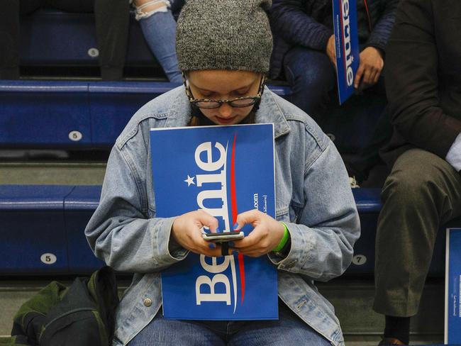 A Bernie Sanders’ supporter weighs up her options: Mr Biden or Mr Trump? Picture: AFP