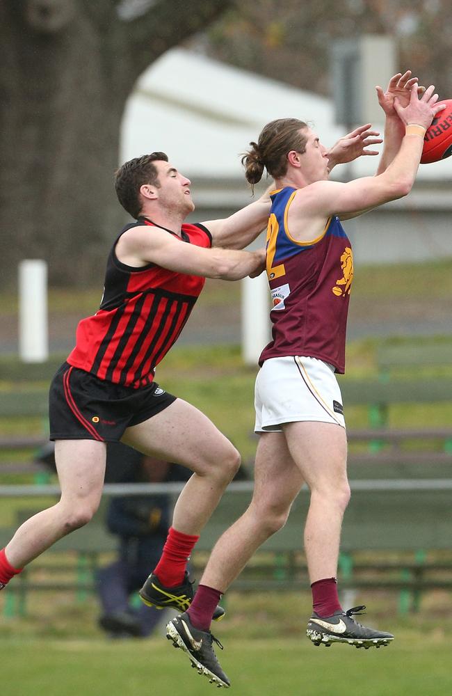 Bailey Brown (right) marks for South Morang during Saturday’s preliminary final. Picture: Hamish Blair