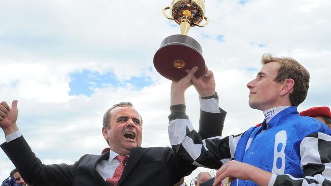 Andreas Wohler and jockey Ryan Moore celebrate Protectionist’s Melbourne Cup win. Picture: Vince Caligiuri/Getty Images