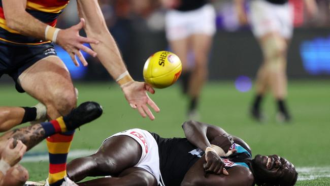 ADELAIDE, AUSTRALIA – JULY 29: Aliir Aliir of the Power down after a collision with Lachie Jones of the Power during the 2023 AFL Round 20 match between the Adelaide Crows and the Port Adelaide Power at Adelaide Oval on July 29, 2023 in Adelaide, Australia. (Photo by Sarah Reed/AFL Photos via Getty Images)