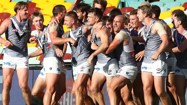 The Power celebrate the winning goal with goal kicker Robbie Gray during the round 7 AFL match between the Carlton Blues and the Power at the Gabba on July 19, 2020 in Brisbane. Picture: Jono Searle/AFL Photos/via Getty Images