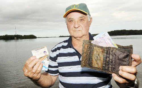 Bert Ranieri, of Alstonville, with the wallet and contents he fished out of the river in Ballina. . Picture: Doug Eaton