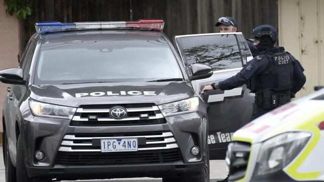 Police outside the home. Picture: Andrew Henshaw