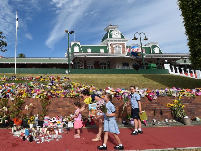 Flowers are laid outside Dreamworld, which cancelled its plans to reopen today after talks with police investigating the incident. Picture: Dave Hunt/AAP