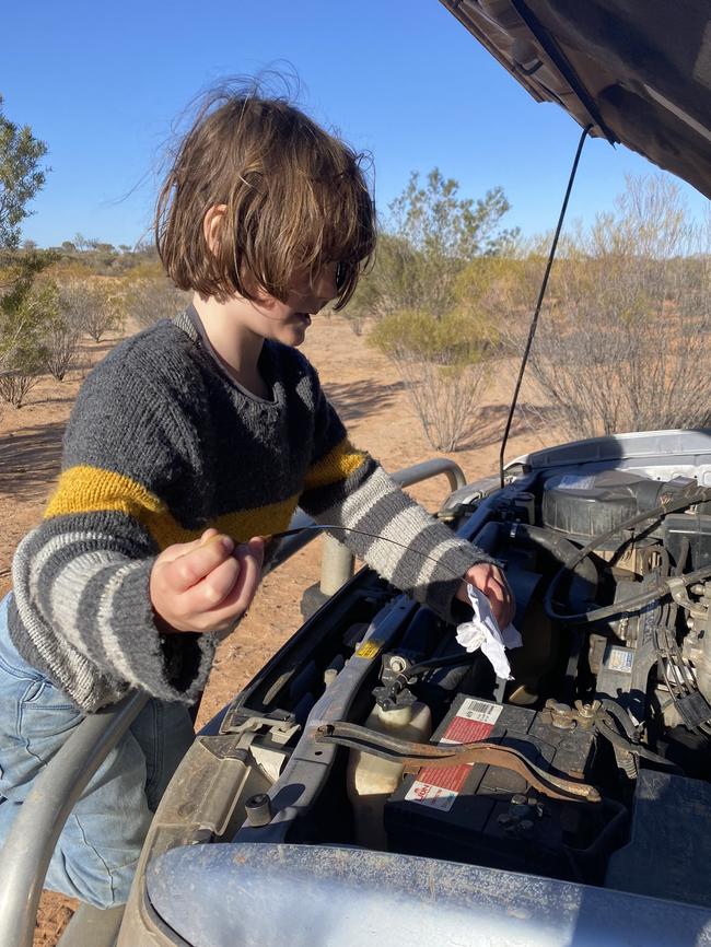 Grady doing an oil check.