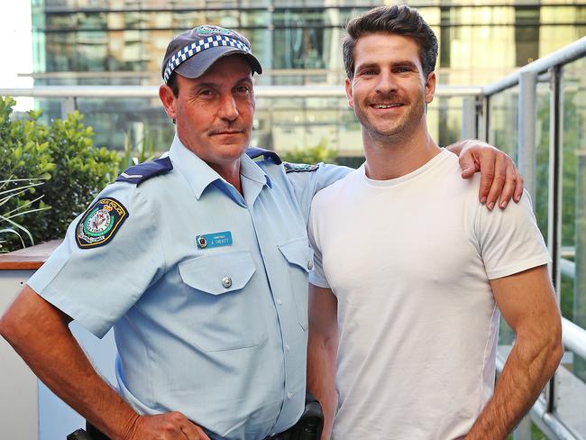 Constable Arun Trevitt with Dan Price, whom he saved from a suicide attempt. Picture: Sam Ruttyn