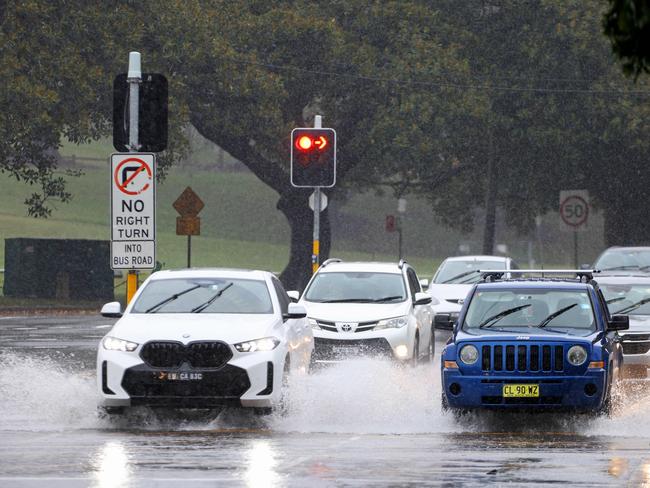 SYDNEY, AUSTRALIA - NewsWire Photos APRIL 5, 2024: Cars on very wet roads in Moore Park.Picture: NCA NewsWire / Damian Shaw