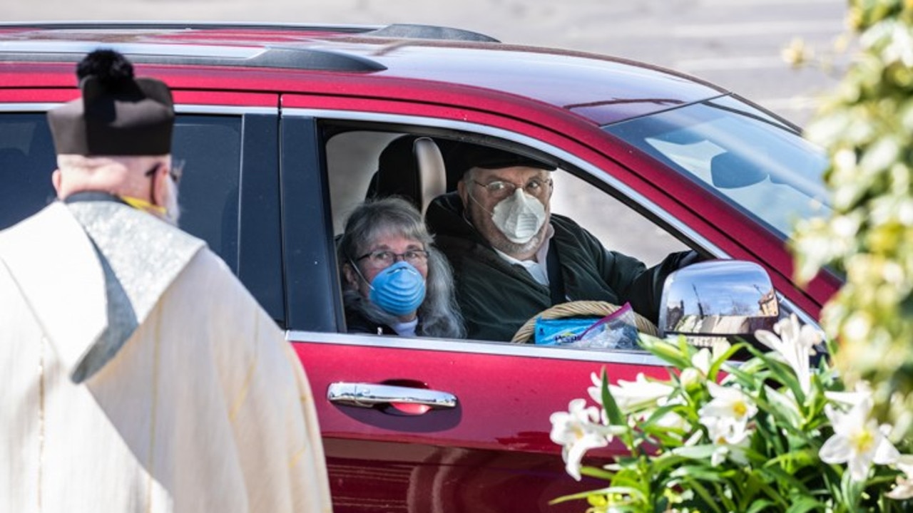 Parishioners came wearing face masks to try and protect their priests.