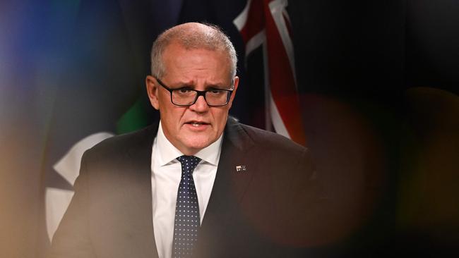 Australia's former prime minister Scott Morrison speaks to media during a press conference in Sydney on August 17, 2022. - Australia's Prime Minister Anthony Albanese on August 16 said that his predecessor Scott Morrison secretly seized control of five ministerial posts, labelling it an "unprecedented trashing of our democracy". (Photo by Steven Saphore / AFP)