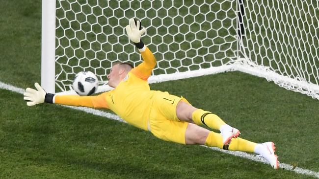 England's goalkeeper Jordan Pickford fails to stop a first-half penalty. Picture: AFP