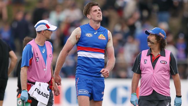 Jordan Roughead leaves the field against Melbourne. Picture: Wayne Ludbey