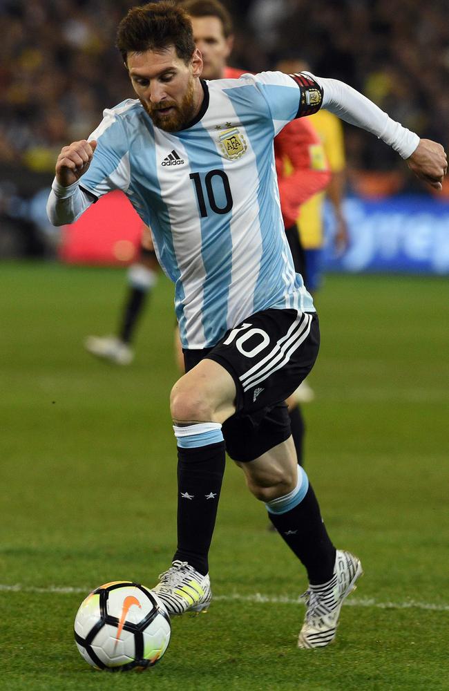 Argentina's Lionel Messi takes on Brazil at the MCG. AFP PHOTO/SAEED KHAN