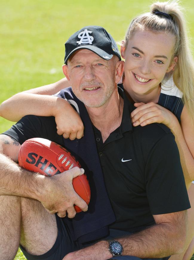 Andrew Brockhurst with his daughter Emily at Noarlunga Oval. Picture: AAP//Brenton Edwards