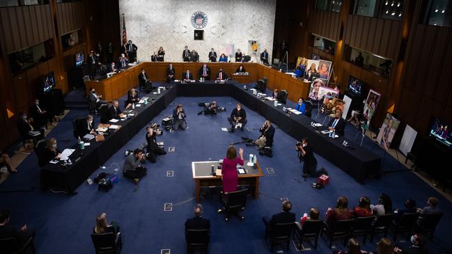 Amy Coney Barrett is sworn in on Capitol Hill in Washington on Tuesday. Picture: AFP