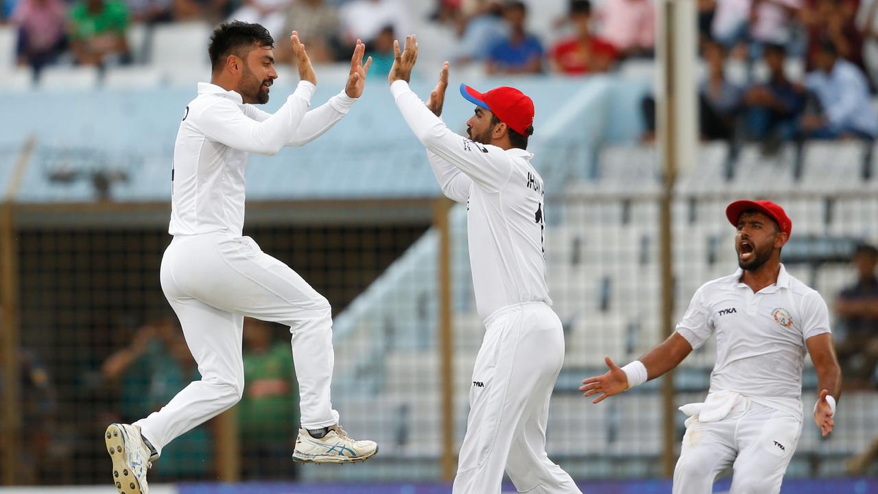 After years of dominating the Big Bash, Afghanistan cricketer Rashid Khan (L) will likely be turning the red ball down under later this year. Photo: Getty images