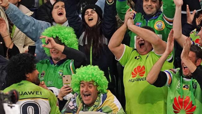 Raiders fans celebrate with backrower Iosia Soliola after their team’s win over competition leaders Melbourne Storm on Saturday. Picture: Scott Barbour/AAP