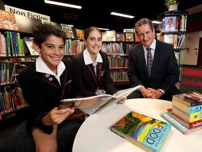 05/12/2019 Haileybury prinicpal Derek Scott with students Noah Goodwin, 11 and his sister Eliza Goodwin, 13 .Picture: David Geraghty, The Australian.